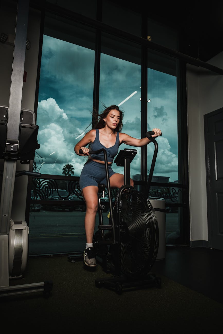 woman working out on a cross trainer